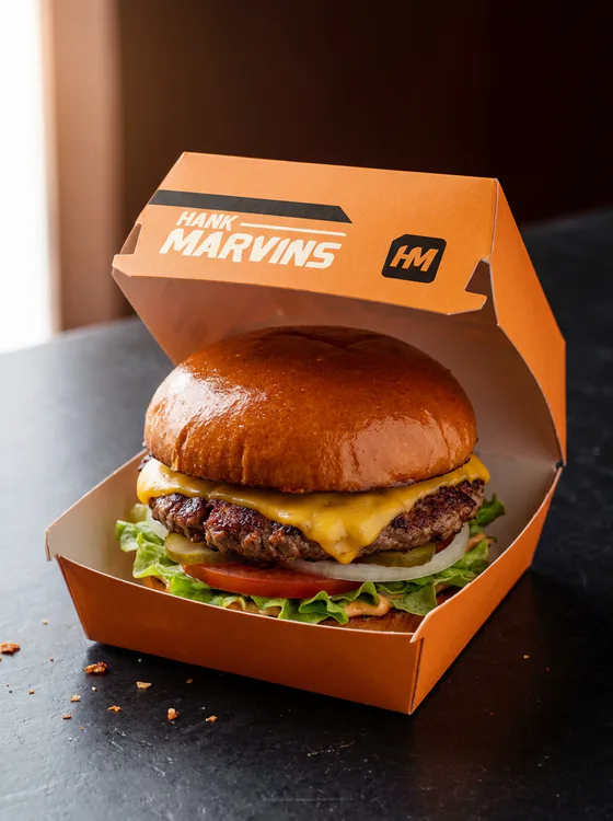 ¼lb cheeseburger, served in Hank Marvins packaging