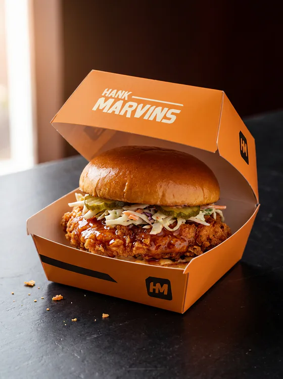 Hot honey chicken burger, served in Hank Marvins packaging